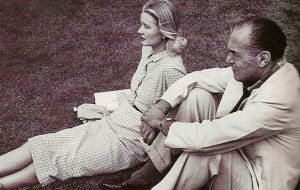 CZ Guest watching the polo in Palm Beach with man-about-town Milton Doc Holden 1949 photographed by Contantin Joff.jpg